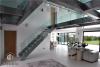 L shape modern staircase with glass railing and glass step