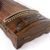 Ancient nanmu guzheng carved with the benevolent behaviors of confucius for performance purpose for